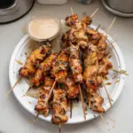 Delicious Bang Bang Chicken Skewers on a plate ready to serve