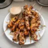 Delicious Bang Bang Chicken Skewers on a plate ready to serve