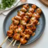 Delicious Bang Bang Chicken Skewers served on a platter