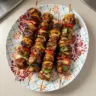 Mexican Barbecue Chicken Skewers on a grill, showcasing vibrant spices.