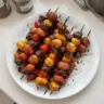 Rosemary garlic steak kebabs with fresh herbs and spices on skewers