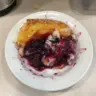 Delicious homemade blackberry batter cake topped with fresh blackberries.