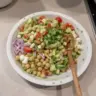 Delicious and colorful chickpea salad with fresh vegetables and dressing