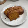 Loaf of classic spiced pumpkin bread with pumpkin seeds and spices