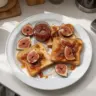 Homemade fig jam in a jar with fresh figs and toast