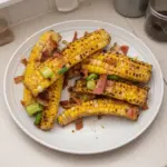 Delicious grilled corn ribs seasoned and served on a plate