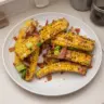 Delicious grilled corn ribs seasoned and served on a plate