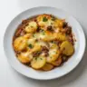 Hobo Casserole with Ground Beef and Potatoes in a baking dish