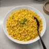 Plate of cooked frozen corn seasoned and ready to serve.
