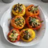 Colorful southwestern stuffed bell peppers filled with quinoa, beans, and spices.
