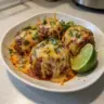 Plate of Spicy Mexican Donkey Balls garnished with fresh herbs