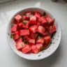 Refreshing watermelon mint salad in a bowl, ideal for summer meals
