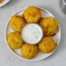 Crispy yellow squash tots served as a healthy snack option