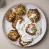 Zucchini fritters with feta cheese served with garlic yogurt sauce