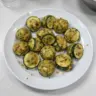 Delicious zucchini garlic bites served on a plate, ready to enjoy.
