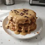Flavorful chocolate chip coffee pancakes stacked on a plate