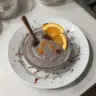 Chocolate orange chia pudding topped with dark chocolate shavings and orange zest.