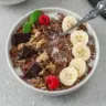 Chunky Monkey Quinoa Breakfast Bowl with bananas, nut butter, and nuts