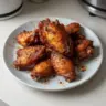 Plate of easy crispy oven baked chicken wings ready in 30 minutes