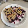Delicious fruity blueberry zucchini bars on a plate, perfect for a healthy snack.