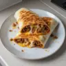Delicious grilled cheese burrito with melted cheese and savory fillings