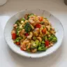 Homemade cashew chicken stir fry with vegetables and rice