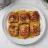 Honey mustard chicken thighs served with vegetables on a plate.