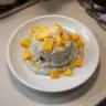 Delicious mango coconut chia pudding in a bowl with fresh mango slices on top