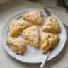 Freshly baked peach scones on a rustic wooden table