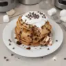 Delicious S'mores pancakes topped with chocolate, marshmallows, and graham cracker crumbs