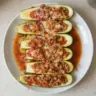 Stuffed zucchini filled with turkey and salsa, garnished and ready to serve.