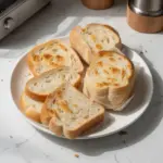 Freshly baked white bread loaf on a wooden table