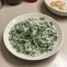 Delicious creamed spinach served in a bowl, garnished and ready to enjoy.