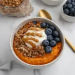 Savory and sweet sweet potato breakfast bowl topped with fresh ingredients